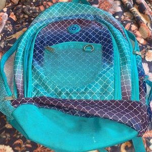 Blue, purple, and white. Girls backpack I used it for cheer for a year.